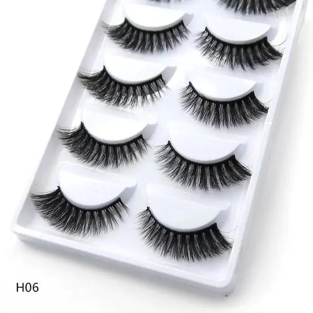 Elegant 3D mink eyelashes in a tray, providing a natural and voluminous eye look.