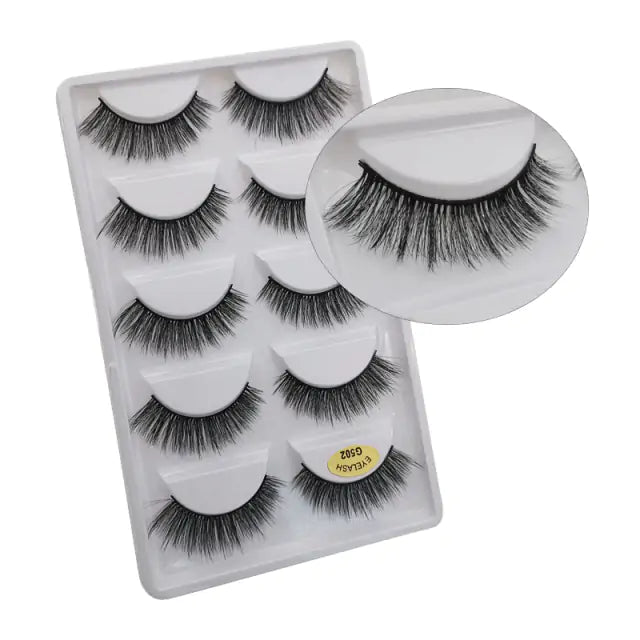 Dramatic 3D mink eyelashes in a tray, featuring five pairs of glamorous false lashes with a voluminous, high-quality appearance for an eye-catching look.